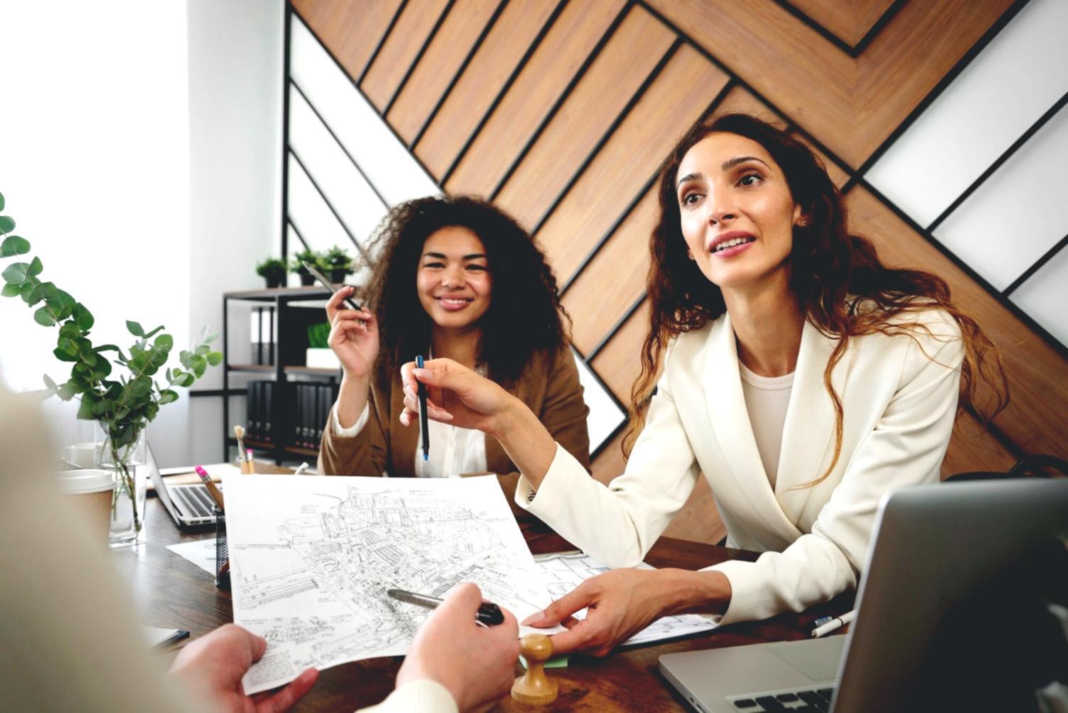 Workshop environment showing practical financial planning tools and collaborative learning setup